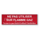 “Do not use on gas flame” sign